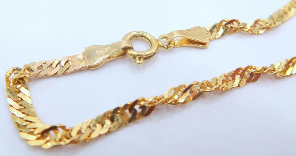 Klenoty Budín Dámský mohutný zlatý náramek TWIST 585/2,62gr 20cm HK7175